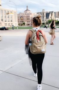 Masen walking away from camera across the square on UW-Madison campus in September 2019